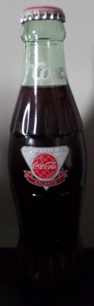 1991-A € 20,00 coca cola flesje 8oz World of Coca cola Atlanta 1st anniversary (coke in neck).jpeg